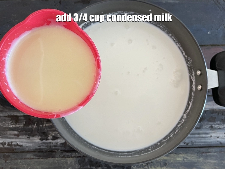 Step 6 – <p><span style="background-color:rgb(255,255,255);color:rgb(0,0,0);">૩/૪ કપ કન્ડેન્સ્ડ મિલ્ક ઉમેરો. Add 3/4 cup </span><a href="https://www.tarladalal.com/glossary-condensed-milk-672i"><u>condensed milk</u></a><u>.</u></p>