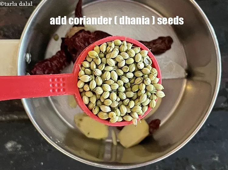 Step 4 – <p><span style="background-color:rgb(255,255,255);color:rgb(0,0,0);">1 ટેબલસ્પૂન </span><a href="https://www.tarladalal.com/glossary-coriander-seeds-dhania-ke-beej-dhania-seeds-akha-dhania-gujarati-371i"><u>આખા ધાણા (coriander seeds)</u></a> ઉમેરો.</p>