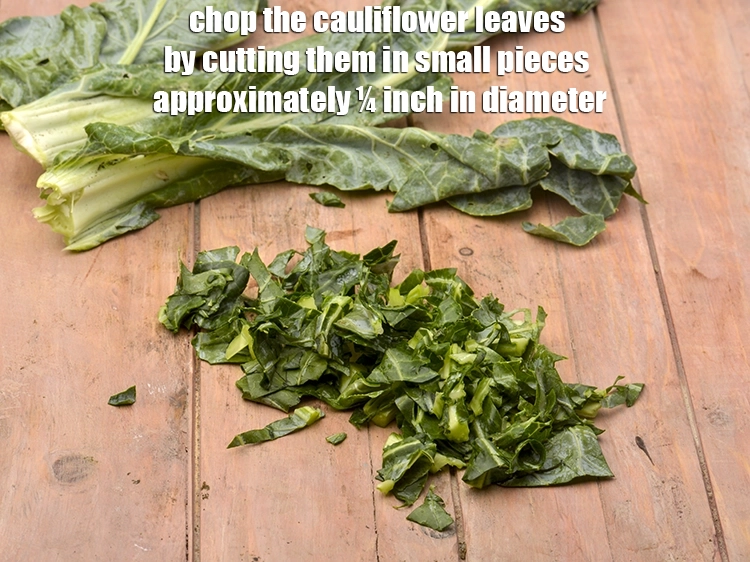 Step 2 – <p>ફૂલકોબીના પાનને સાફ કરો અને ધોઈ લો. ફૂલકોબીના પાનના ગુચ્છામાંથી જાડા દાંડા કાઢી નાખો. ફૂલકોબીના …