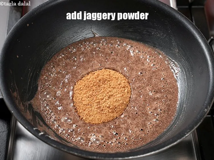 Step 4 – <p><span style="background-color:rgb(255,255,255);color:rgb(0,0,0);">5 ટેબલસ્પૂન </span><a href="https://www.tarladalal.com/glossary-jaggery-powder-gujarati-2815i"><u>ગોળ પાવડર (jaggery powder (gur powder)</u></a> ઉમેરો.</p>