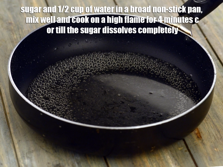 Step 6 – <p><span style="background-color:rgb(255,255,255);color:rgb(0,0,0);">1/2 કપ </span><a href="https://www.tarladalal.com/glossary-sugar-chini-shakkar-gujarati-278i"><u>સાકર (sugar)</u></a> અને ૧/૨ કપ પાણીને એક પહોળા નોન-સ્ટીક પેનમાં ભેળવીને, …