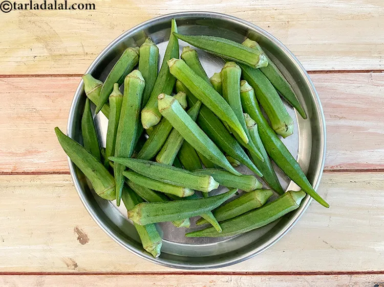 Step 1 – <p>ભીંડા (ઓકરા, લેડીઝ ફિંગર) આના જેવી દેખાય છે.</p>
