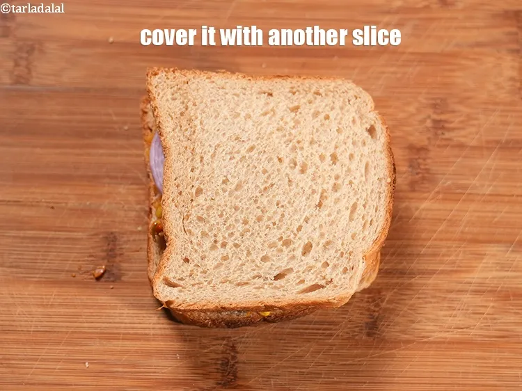 Step 25 – <p>બીજા આખા ઘઉંના <span style="background-color:rgb(255,255,255);color:rgb(0,0,0);">બ્રેડની સ્લાઇસ</span>નો ઉપયોગ કરીને સેન્ડવિચ <span style="background-color:rgb(255,255,255);color:rgb(0,0,0);">બનાવી લો.</span></p>