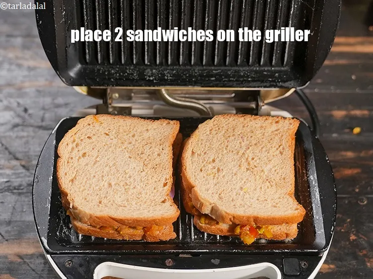Step 27 – <p>ગ્રીલર પર 2 સેન્ડવિચ મૂકો.</p>