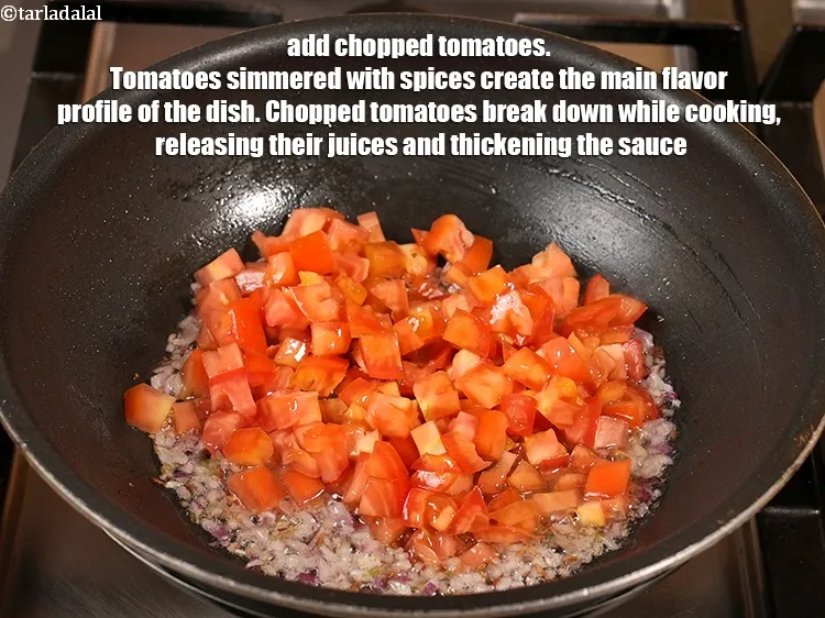 Step 13 – <p><span style="background-color:rgb(255,255,255);color:rgb(0,0,0);">1 કપ </span><a href="https://www.tarladalal.com/glossary-tomatoes-tamatar-gujarati-639i#ing_2361"><u>સમારેલા ટામેટા (chopped tomatoes)</u></a> ઉમેરો. મસાલા સાથે બાફેલા ટામેટાં વાનગીનો મુખ્ય …