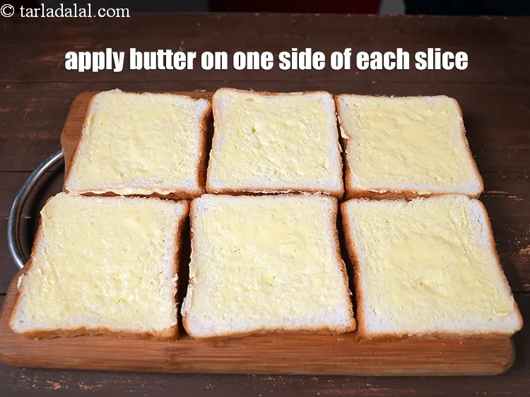 Step 11 – <p>દરેક સ્લાઈસની એક બાજુ 1/2 &nbsp;<a href="https://www.tarladalal.com/glossary-butter-makhan-gujarati-233i"><u>માખણ (butter, makhan)</u></a> લગાવો.</p>