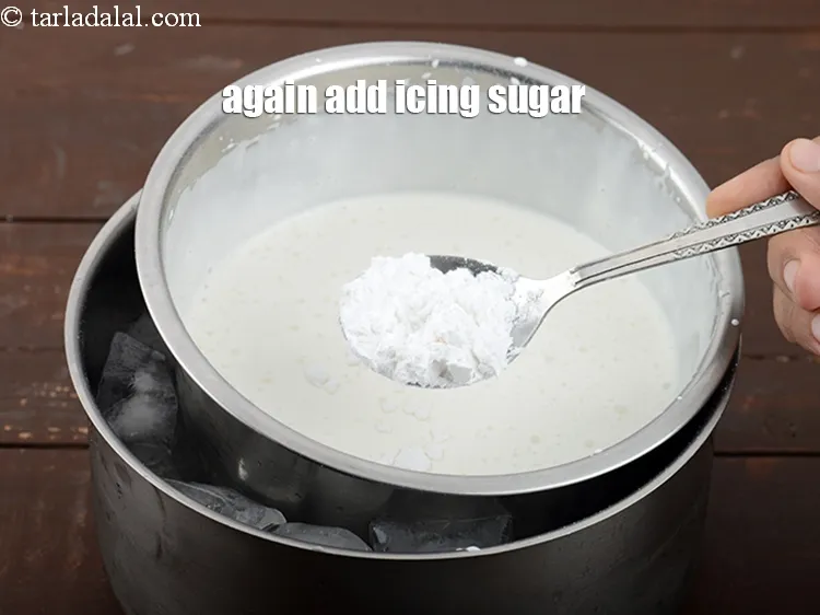 Step 13 – <p>ફરીથી 1 <span style="background-color:rgb(255,255,255);color:rgb(0,0,0);">ટેબલસ્પૂન </span>આઈસિંગ સુગર ઉમેરો.</p>