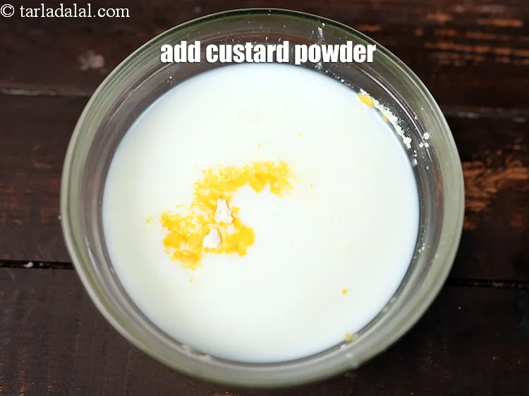 Step 2 – <p><span style="background-color:rgb(255,255,255);color:rgb(0,0,0);">2 ટેબલસ્પૂન </span><a href="https://www.tarladalal.com/glossary-custard-powder-gujarati-512i"><u>કસ્ટર્ડ પાવડર (custard powder)</u></a> ઉમેરો.</p>