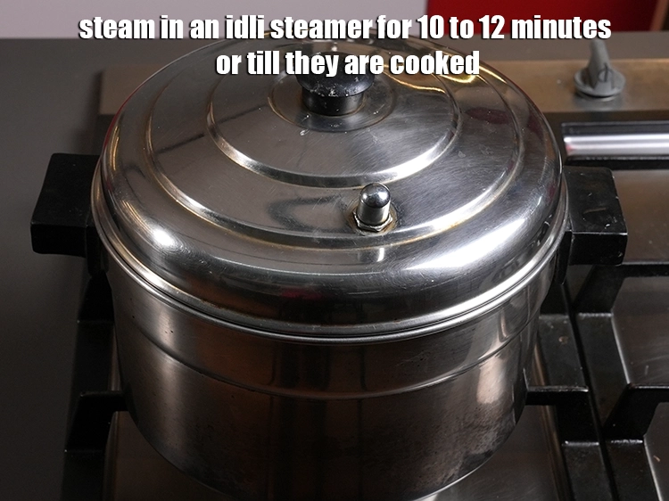 Step 8 – <p>ઇડલી સ્ટીમરમાં 10 થી 12 મિનિટ અથવા તે રાંધાય ત્યાં સુધી સ્ટીમ કરો.</p>