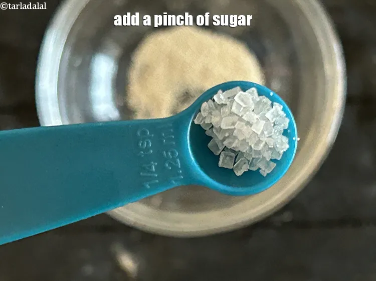 Step 2 – <p>એક ચપટી <a href="https://www.tarladalal.com/glossary-sugar-chini-shakkar-gujarati-278i"><u>સાકર (sugar)</u></a> ઉમેરો.</p>