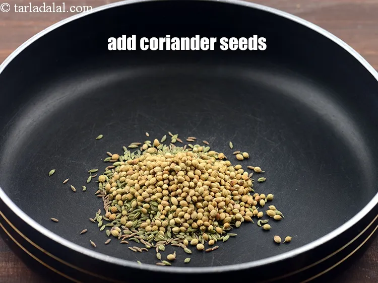 Step 12 – <p><span style="background-color:rgb(255,255,255);color:rgb(0,0,0);">1 ટેબલસ્પૂન </span><a href="https://www.tarladalal.com/glossary-coriander-seeds-dhania-ke-beej-dhania-seeds-akha-dhania-gujarati-371i"><u>આખા ધાણા (coriander seeds)</u></a> ઉમેરો.</p>