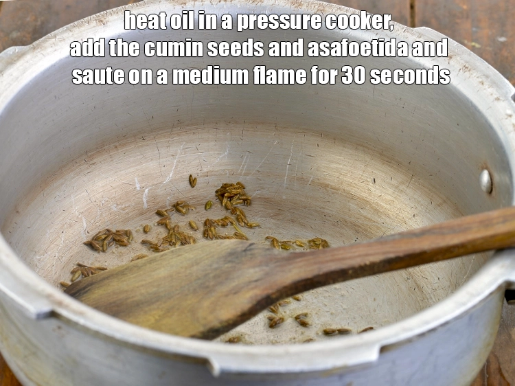 Step 2 – <p>એક પ્રેશર કુકરમાં <span style="background-color:rgb(255,255,255);color:rgb(0,0,0);">1 ટીસ્પૂન </span><a href="https://www.tarladalal.com/glossary-oil-gujarati-671i"><u>તેલ ( oil )</u></a> ગરમ કરી તેમાં <span …