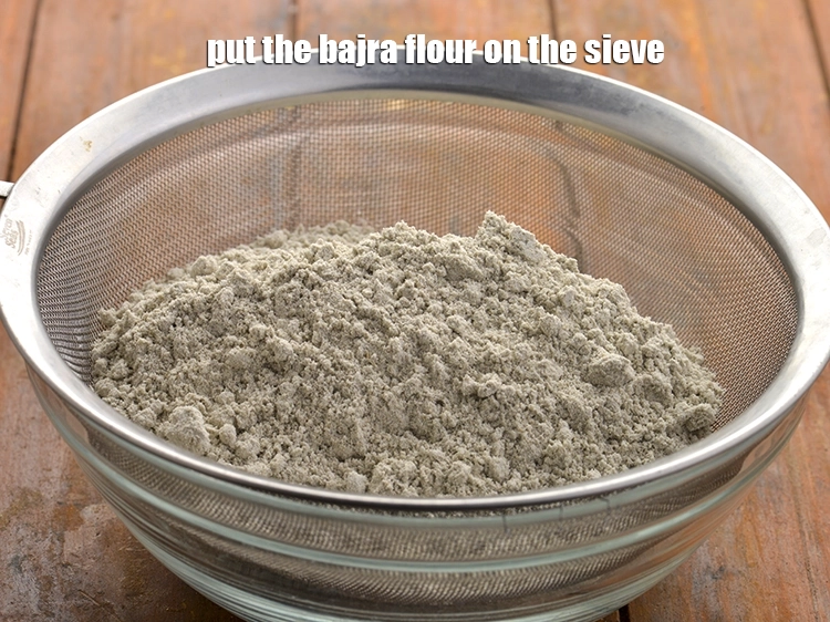 Step 2 – <p><span style="background-color:rgb(255,255,255);color:rgb(0,0,0);">2 કપ </span><a href="https://www.tarladalal.com/glossary-bajra-flour-bajra-ka-atta-bajre-ka-atta-gujarati-176i"><u>બાજરીનો લોટ (bajra flour)</u></a> ચાળણી પર મૂકો. બાજરીનો લોટ હૃદય, ડાયાબિટીસ …