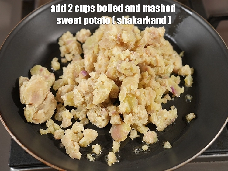 Step 13 – <p><span style="background-color:rgb(255,255,255);color:rgb(0,0,0);">2 કપ </span><a href="https://www.tarladalal.com/glossary-sweet-potato-shakarkand-gujarati-956i#ing_2609"><u>બાફીને છૂંદેલા શક્કરિયા (boiled and mashed sweet potato)</u></a> ઉમેરો.</p>