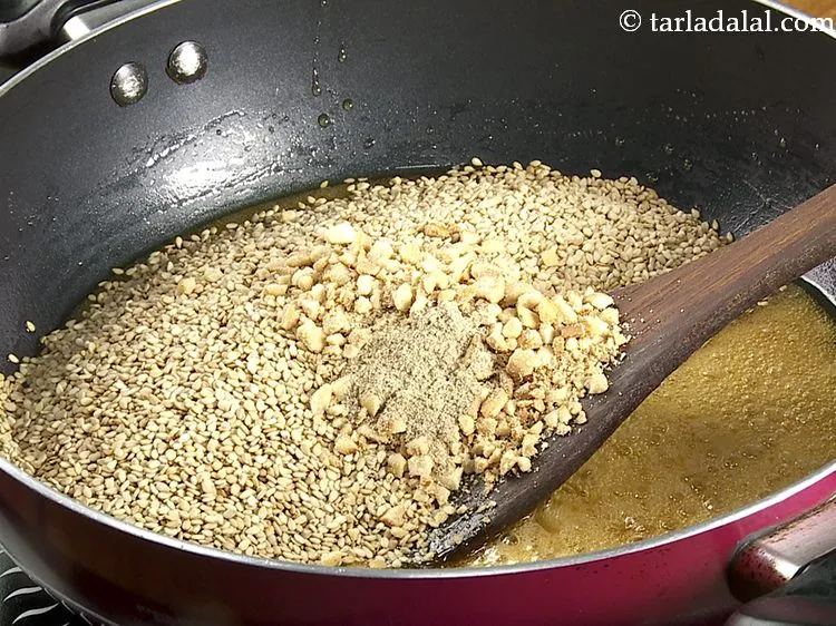 Step 9 – <p>એલચી પાવડર ઉમેરો. તિલકે લાડુને વધુ સ્વાદિષ્ટ બનાવવા માટે તમે સૂકું નારિયેળ પણ ઉમેરી શકો …