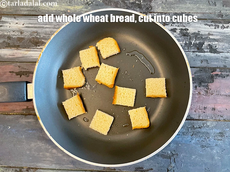 Step 22 – <p>ક્યુબ્સમાં કાપેલા ઘઉંના બ્રેડના ટુકડા ઉમેરો.</p>