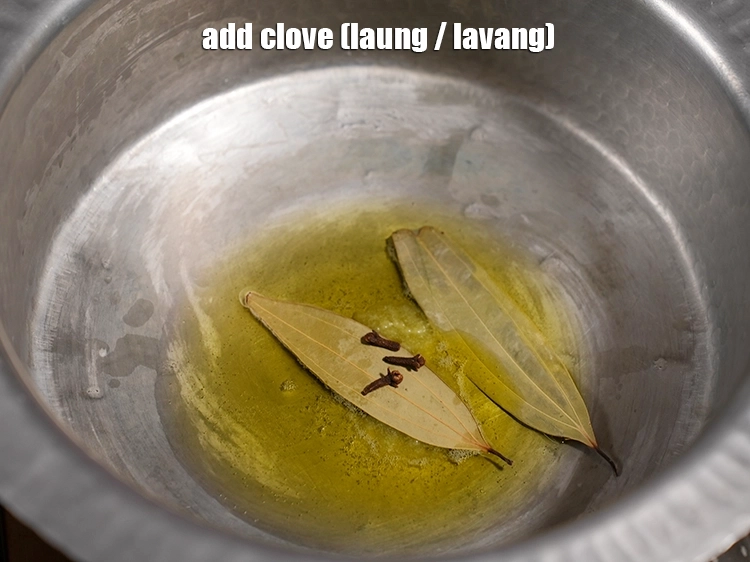 Step 20 – <p><span style="background-color:rgb(255,255,255);color:rgb(0,0,0);">3 </span><a href="https://www.tarladalal.com/glossary-cloves-laung-lavang-gujarati-322i"><u>લવિંગ (cloves, lavang)</u></a><u> ઉમેરો.</u></p>