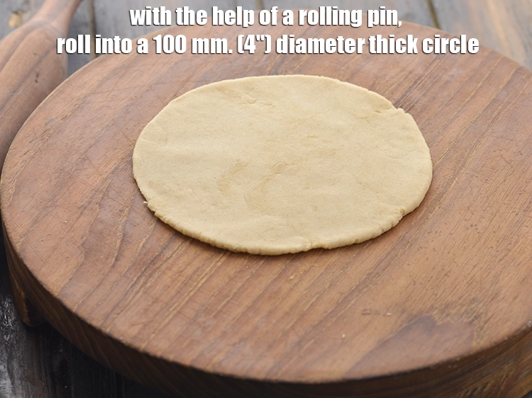 Step 15 – <p>વણવાની મદદથી, લોટને 100 મીમી. (4") જાડા ગોળ આકારમાં વણો. તે પરાઠા કરતાં જાડી હોવી …