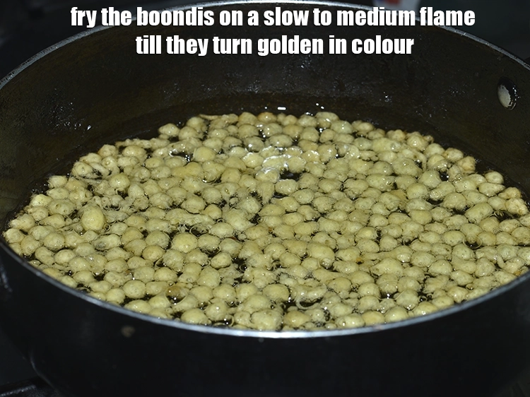 Step 13 – <p style="margin-left:0px;">બુંદીઓને ધીમા થી મધ્યમ તાપ પર સોનેરી રંગના થાય ત્યાં સુધી તળો.</p>