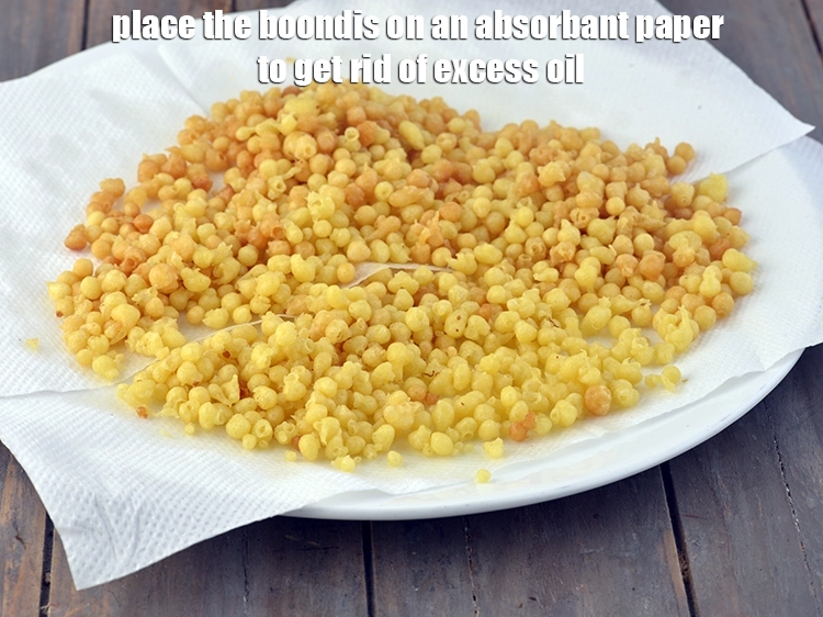 Step 15 – <p style="margin-left:0px;">વધારાનું તેલ કાઢવા માટે બુંદીઓને શોષક કાગળ પર મૂકો. આ <strong>ઝારા એ</strong>નો ઉપયોગ કરીને …