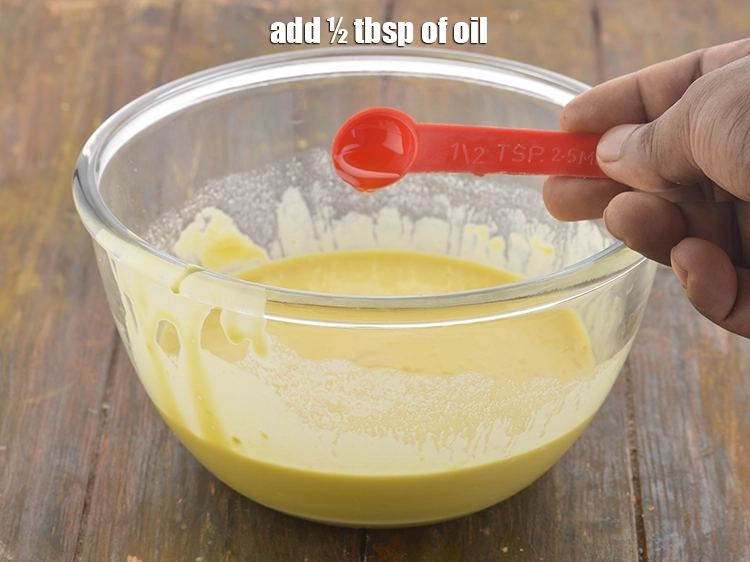 Step 6 – <p>1/2 ચમચી તેલ ઉમેરો. આનાથી બુંદી ક્રિસ્પી બનશે અને બેટરને તળવા માટે ગરમ તેલમાં સરળતાથી …