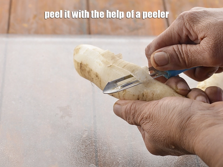 Step 2 – <p>પીલરની મદદથી તેને છોલી લો.</p>