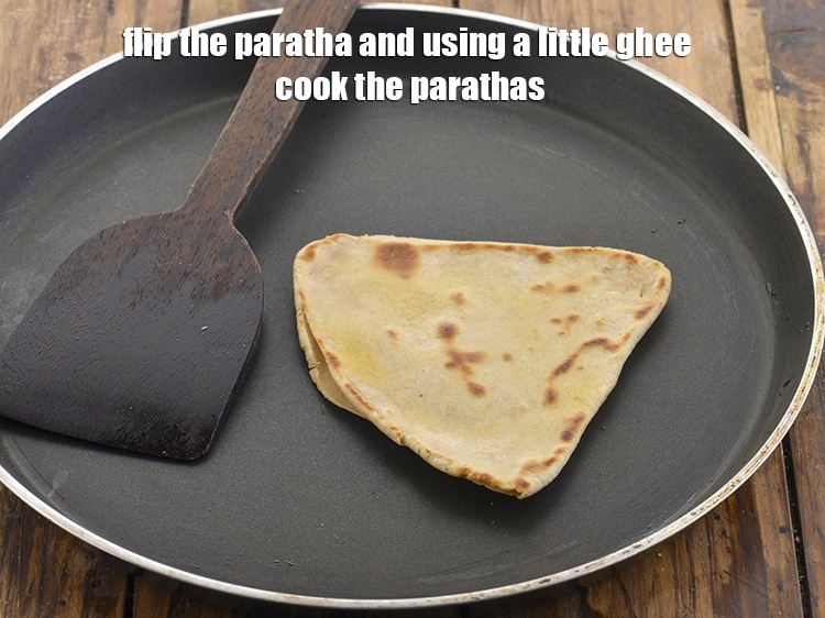 Step 21 – <p>અને થોડું ઘી વાપરીને પરાઠા રાંધો. બીજી બાજુ પણ આછા ભૂરા રંગના થાય ત્યાં સુધી …