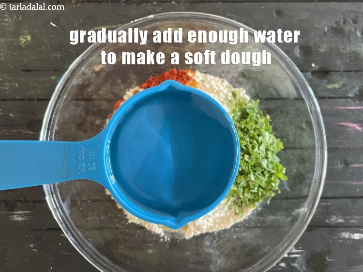 Step 10 – <p>ધીમે ધીમે પૂરતું પાણી ઉમેરો જેથી નરમ કણક બને. અમે પહેલા ૧/૩ કપ પાણી ઉમેર્યું …