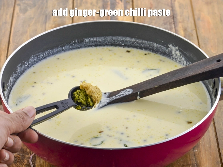 Step 8 – <p><span style="background-color:rgb(255,255,255);color:rgb(0,0,0);">1 ટીસ્પૂન </span><a href="https://www.tarladalal.com/glossary-ginger-green-chilli-paste-adrak-mirch-ki-paste-adrak-mirchi-paste-gujarati-139i"><u>આદુ-લીલા મરચાંની પેસ્ટ (ginger-green chilli paste)</u></a> ઉમેરો. તે ગુજરાતી કઢીને સરસ …
