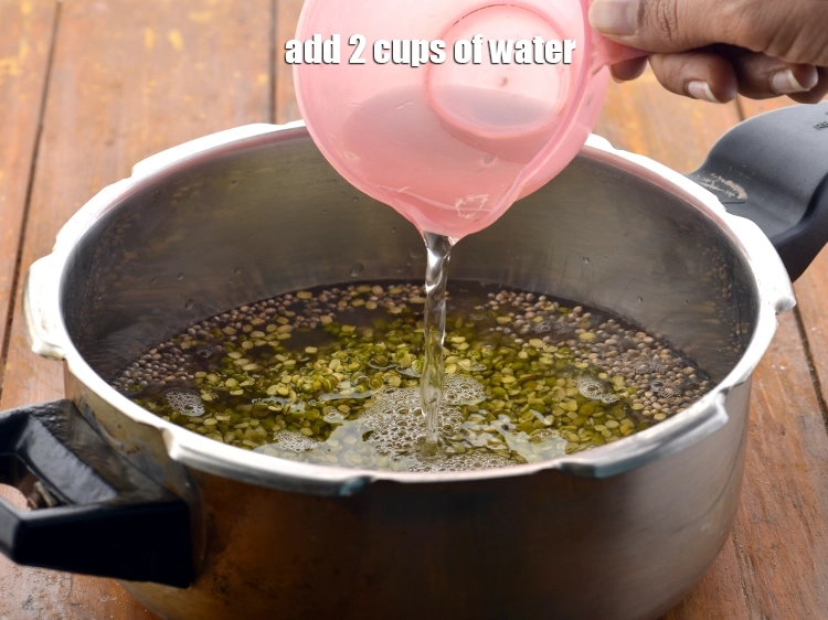 Step 12 – <p>પ્રેશર કુકરમાં ૨ કપ <strong>પાણી</strong> ઉમેરો.</p>