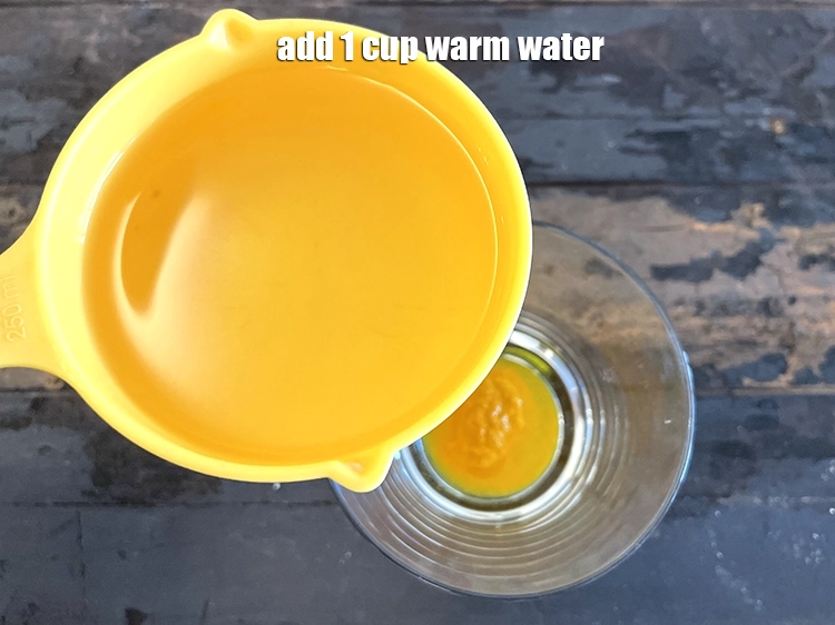 Step 8 – <p>તેમાં 1 કપ ગરમ પાણી ઉમેરો.</p>