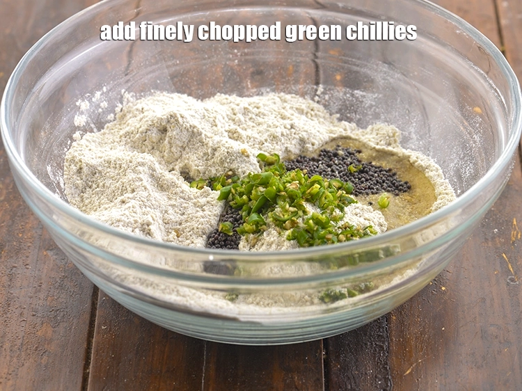 Step 9 – <p>હવે તીખાશ માટે <span style="background-color:rgb(255,255,255);color:rgb(0,0,0);">2 ટીસ્પૂન </span><a href="https://www.tarladalal.com/glossary-green-chillies-hari-mirch-gujarati-331i#ing_3504"><u>બારીક સમારેલા લીલા મરચા (finely chopped green chillies)</u></a> …