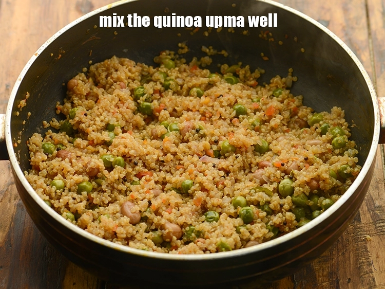 Step 27 – <p><strong>ક્વિનોઆ ઉપમા</strong>ને સારી રીતે મિક્સ કરો.</p>