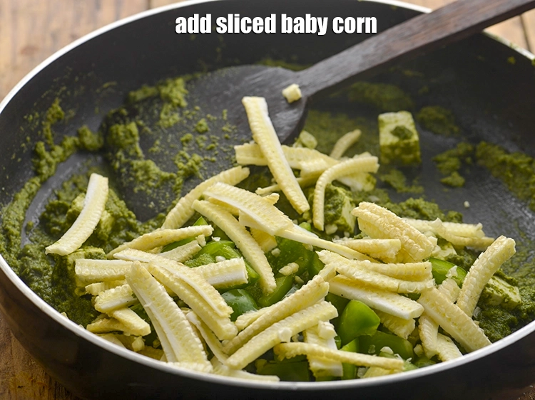 Step 16 – <p><span style="background-color:rgb(255,255,255);color:rgb(0,0,0);">1/2 કપ </span><a href="https://www.tarladalal.com/glossary-baby-corn-gujarati-720i#ing_2346"><u>સ્લાઇસ કરેલા બેબી કોર્ન (sliced baby corn)</u></a> ઉમેરો.</p>