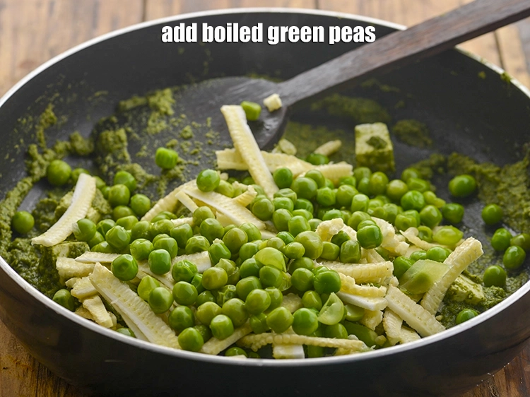 Step 17 – <p><span style="background-color:rgb(255,255,255);color:rgb(0,0,0);">1/2 કપ </span><a href="https://www.tarladalal.com/glossary-green-peas-matar-hare-matar-vatana-gujarati-180i#ing_2431"><u>બાફેલા લીલા વટાણા (boiled green peas)</u></a> ઉમેરો.</p>