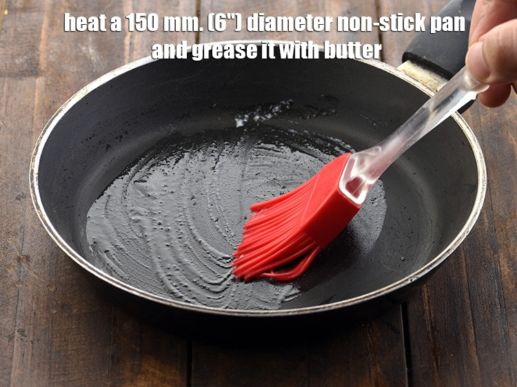 Step 9 – <p>૧૫૦ મીમી (૬”) નોન-સ્ટીક પેન ગરમ કરો અને તેના પર <a href="https://www.tarladalal.com/glossary-butter-makhan-gujarati-233i#ing_3123"><u>પીગળાવેલું માખણ (melted butter)</u></a>થી …