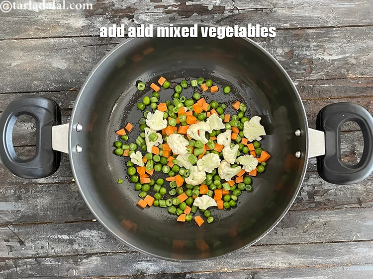 Step 27 – <p><span style="background-color:rgb(255,255,255);color:rgb(0,0,0);">1 કપ </span><a href="https://www.tarladalal.com/glossary-mixed-vegetables-mixed-sabzi-gujarati-723i#ing_2364"><u>સમારેલી મિક્સ શાકભાજી (chopped mixed vegetables) </u></a><span style="background-color:rgb(255,255,255);color:rgb(0,0,0);">(ફણસી , ગાજર , …