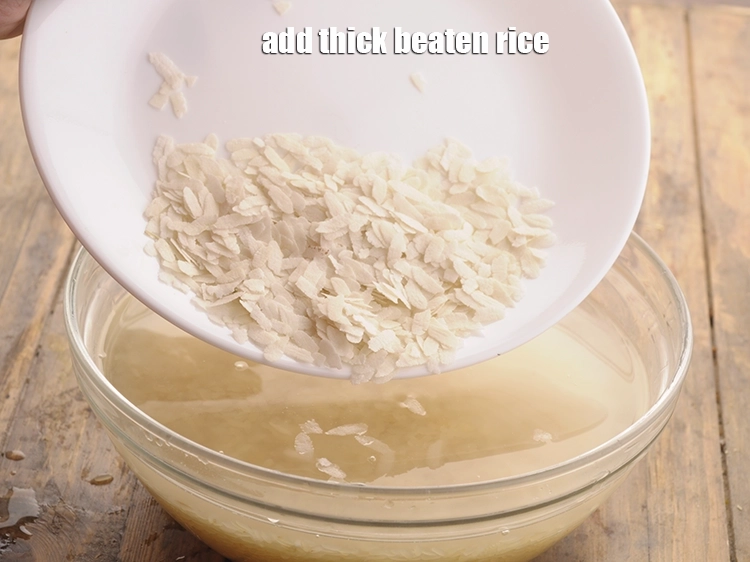 Step 32 – <p>ઉપરાંત, <span style="background-color:rgb(255,255,255);color:rgb(0,0,0);">2 ટેબલસ્પૂન </span><a href="https://www.tarladalal.com/glossary-beaten-rice-poha-rice-flakes-flaked-rice-gujarati-536i#ing_2943"><u>જાડા પૌવા (thick beaten rice (jada poha)</u></a> ઉમેરો. પોહા ઉમેરવાથી …