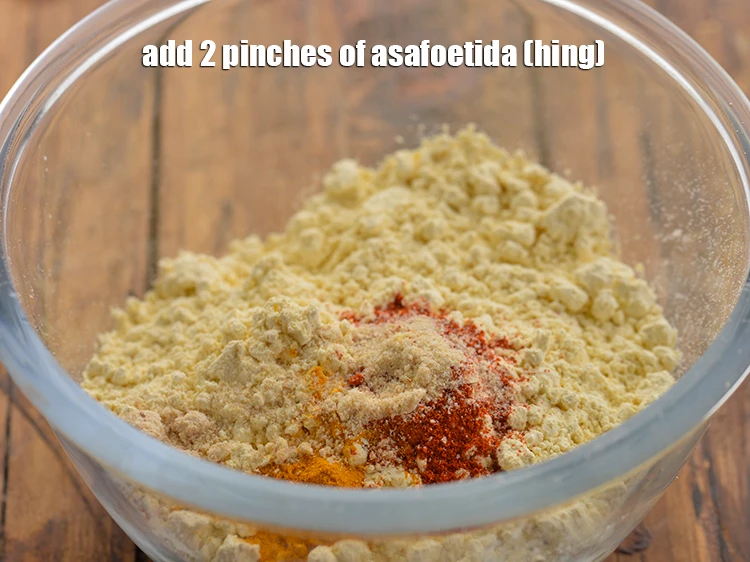 Step 15 – <p><strong>2 ચપટી </strong><a href="https://www.tarladalal.com/glossary-asafoetida-hing-gujarati-113i"><u>હીંગ (asafoetida, hing)</u></a> ઉમેરો. તે પાચનમાં મદદ કરે છે.</p>