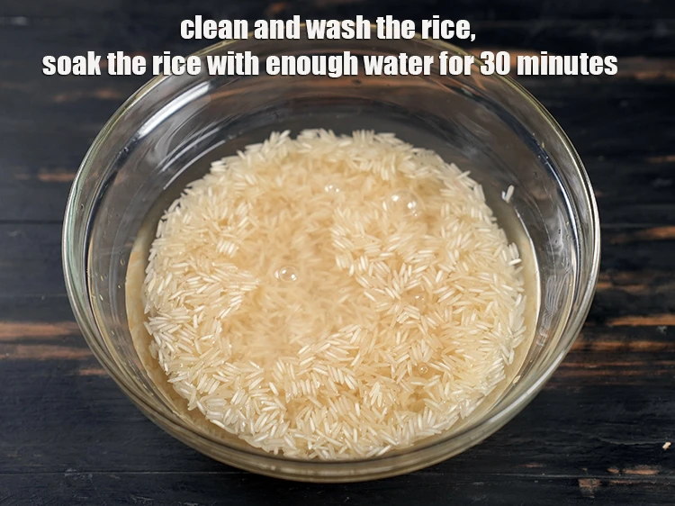 Step 2 – <p>ચોખા સાફ કરો અને ધોઈ લો, ચોખાને પૂરતા પાણીથી ૩૦ મિનિટ સુધી પલાળી રાખો.</p>