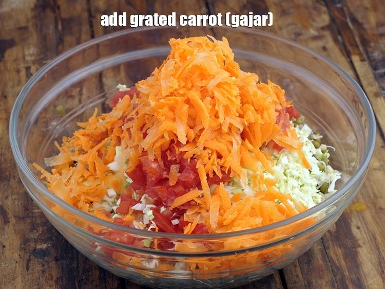 Step 7 – <p>છીણેલું ગાજર ઉમેરો. જો કાચી કેરી સિઝનમાં હોય, તો તેને જરૂર ઉમેરો. છીણેલું બીટ, સમારેલી …