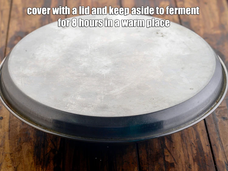 Step 21 – <p>ઢાંકણથી ઢાંકી દો અને ગરમ જગ્યાએ 8 કલાક માટે આથો લાવવા માટે બાજુ પર રાખો. …