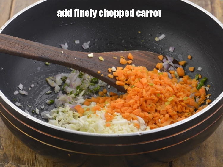 Step 21 – <p>આ ઉપરાંત, <span style="background-color:rgb(255,255,255);color:rgb(0,0,0);">1/4 કપ </span><a href="https://www.tarladalal.com/glossary-carrot-gajar-gajjar-gujarati-253i#ing_2376"><u>સમારેલા ગાજર (chopped carrot)</u></a> ઉમેરો.</p>