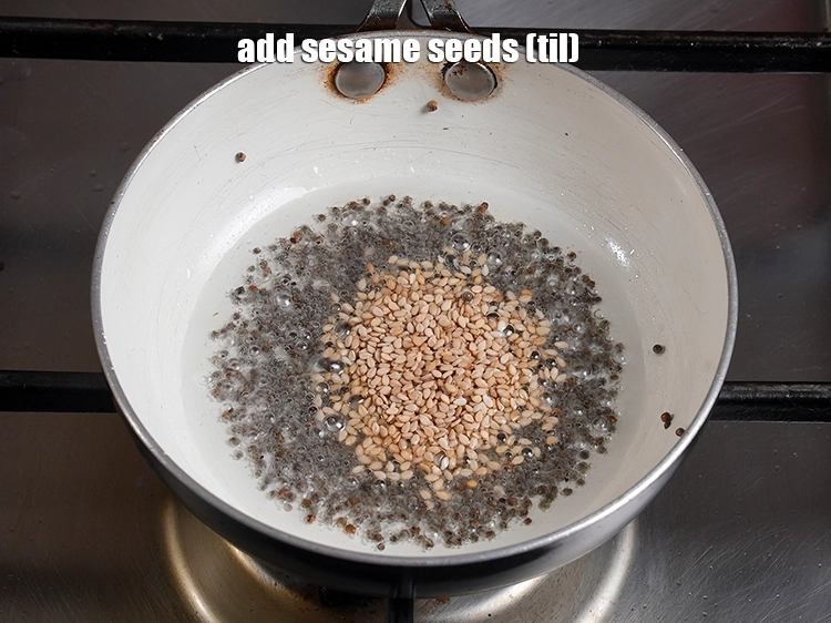 Step 33 – <p><span style="background-color:rgb(255,255,255);color:rgb(0,0,0);">2 ટીસ્પૂન </span><a href="https://www.tarladalal.com/glossary-sesame-seeds-til-gingelly-seeds-gujarati-612i"><u>તલ (sesame seeds, til)</u></a><u> </u>ઉમેરો.</p>