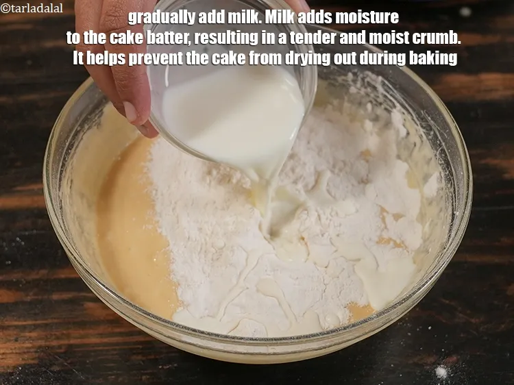 स्टेप 15 – <p>धीरे-धीरे 1/4 कप <a href="https://www.tarladalal.com/glossary-milk-doodh-full-cream-milk-hindi-514i"><u>दूध (milk)</u></a> डालें। दूध केक के …