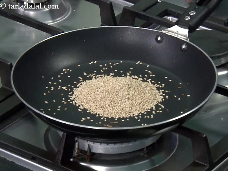 स्टेप 17 – <p>उसी पैन में 1<span style="background-color:rgb(255,255,255);color:rgb(0,0,0);">1/4 कप </span><a href="https://www.tarladalal.com/glossary-sesame-seeds-til-gingelly-seeds-hindi-612i"><u>तिल (sesame seeds, …