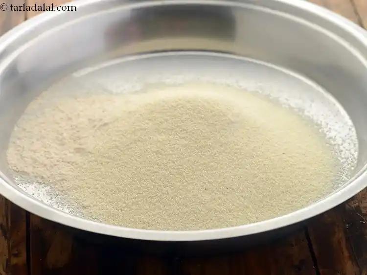 स्टेप 54 – <p>सूजी डालें।</p>