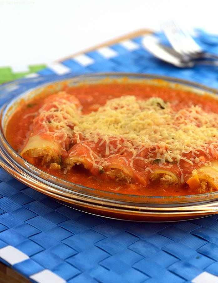 Baked Canneloni with Pomodoro Sauce,filled with mixed vegetables and cottage cheese, the cannelloni when coated with Pomodoro sauce, evolves into a dish that you just cannot resist gobbling up!