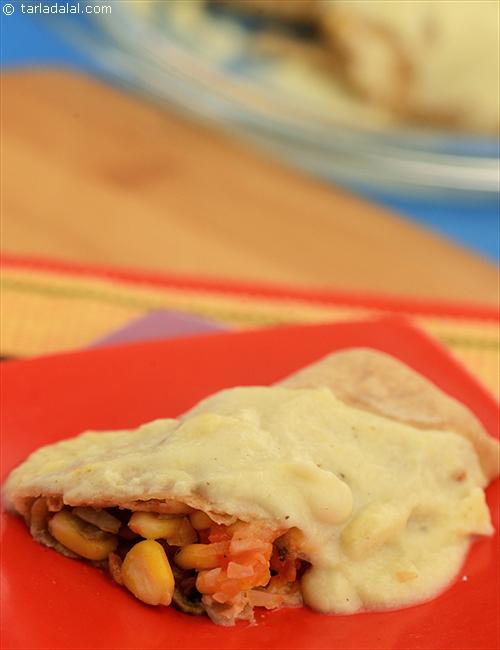 Baked Vegetable Roll Up, this is a wonderful dish to make from left-over chapatis. The corn and mushroom filling adds crunchiness to these rolls.