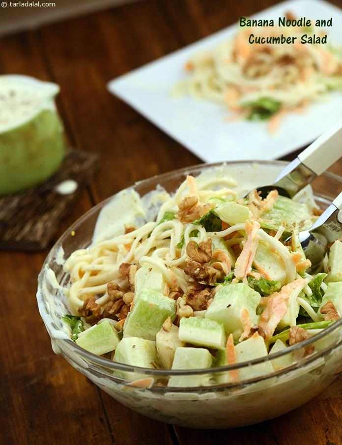 Banana Noodle and Cucumber Salad, a mind-boggling combination of banana, cucumber and boiled noodles along with lettuce and carrots transforms into a very exciting salad when topped with salad cream and crunchy walnuts. 
